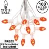 100 C7 String Light Set With Orange Bulbs On White Wire