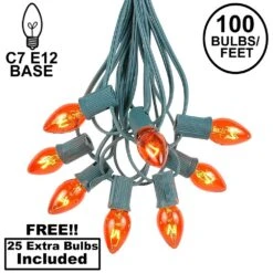 100 C7 String Light Set With Orange Bulbs On Green Wire