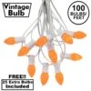 100 C7 String Light Set With Orange Ceramic Bulbs On White Wire