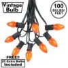 100 C7 String Light Set With Orange Ceramic Bulbs On Black Wire
